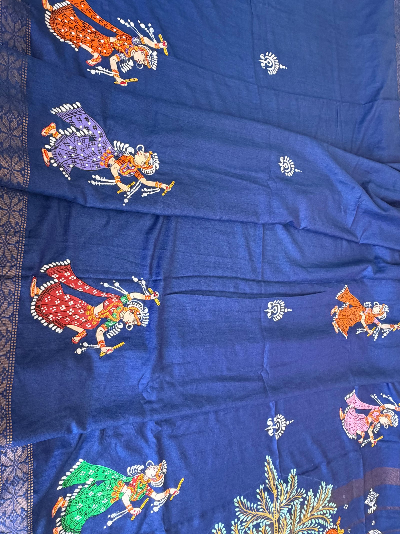 Pattachitra textile with colourful dancing characters