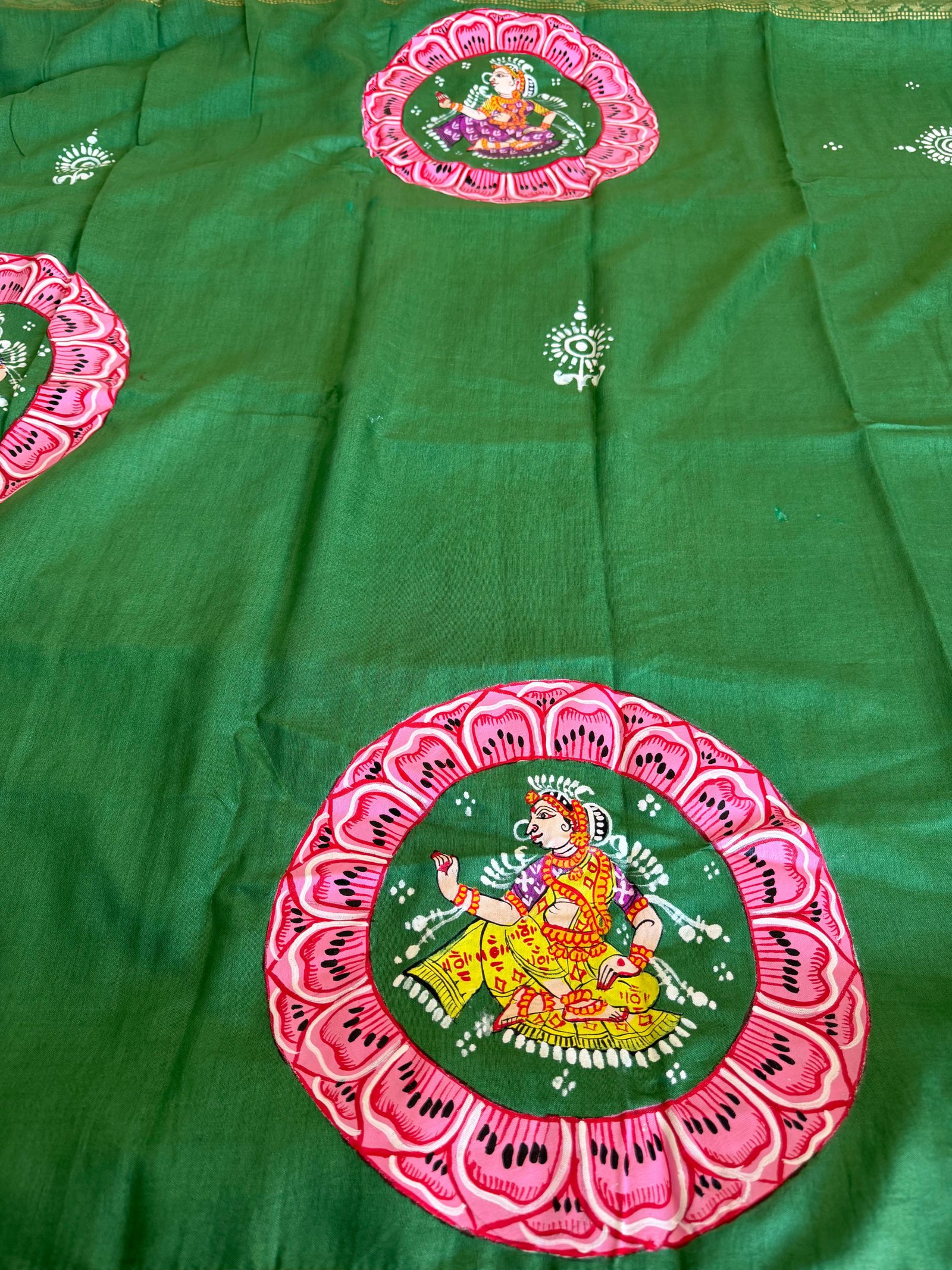 Pattachitra textile with a painted dancer inside a floral medallion